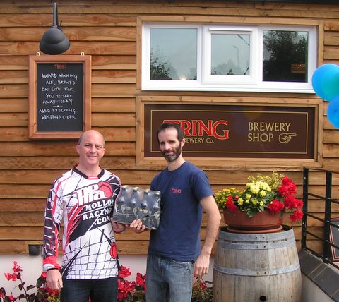 Paul collects his prize from Ben of Tring Brewery